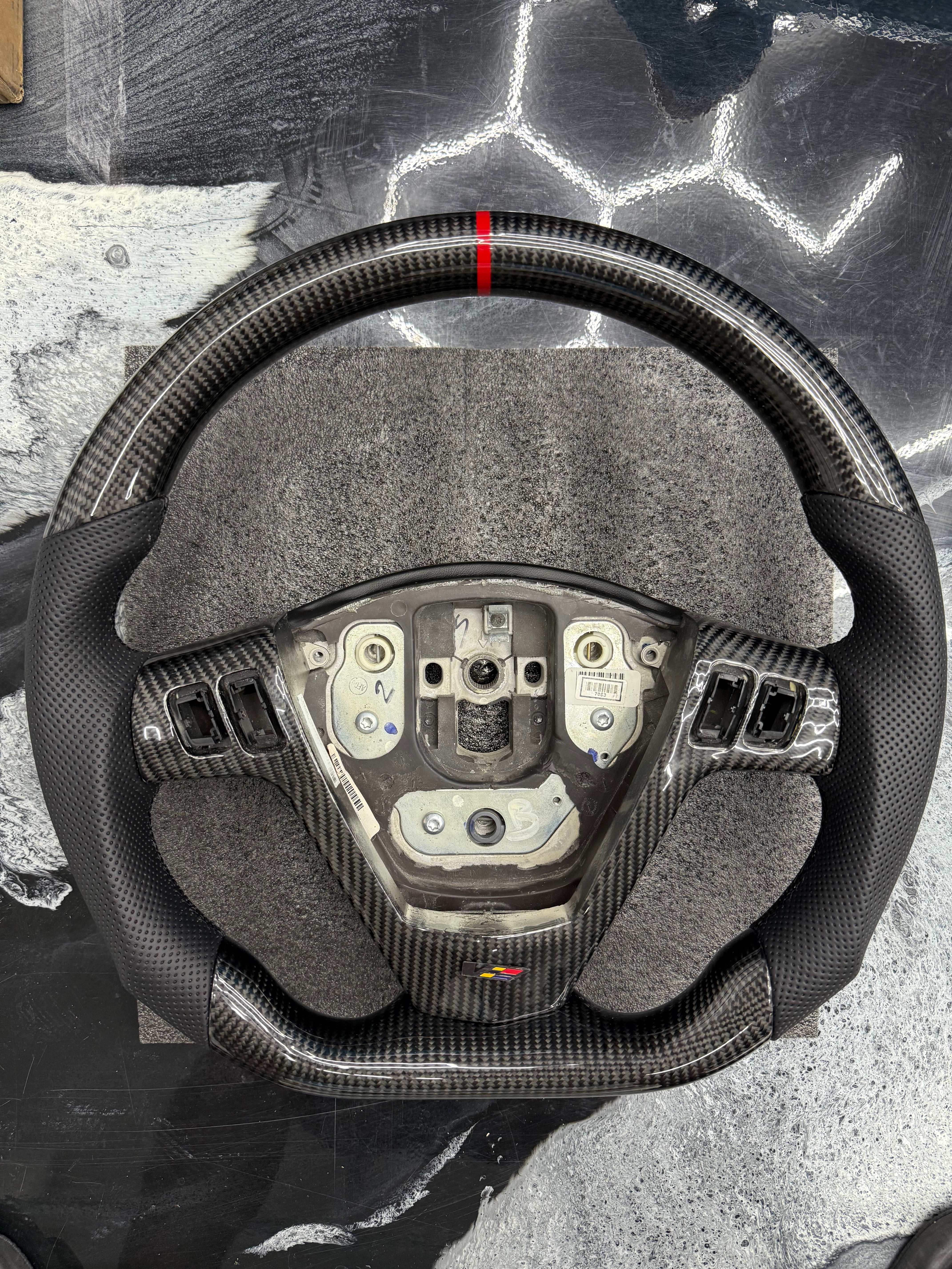 2003 - 2008 CTS, CTS-V V1 Custom Carbon Fiber Steering Wheel with Perforated Leather Hand Grips / Leather Rear Cover